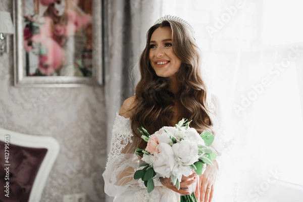 Fototapeta Luxury wedding bride, girl posing and smiling with bouquet