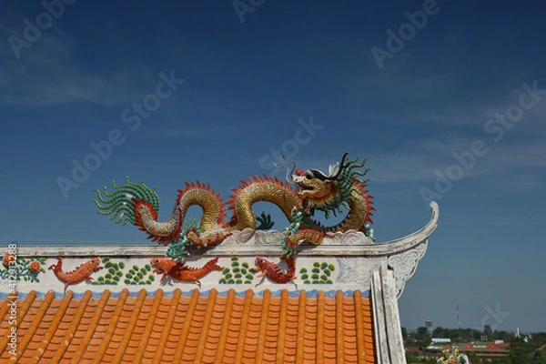 Fototapeta Beautiful Dragon Sculpture on The Roof in Wihan Thep Sathit Phra Kitthi Chalerm Shrine (Nacha Sa Thai Chue Shrine or Naja Shrine) Bang Sean, Chonburi, Thailand