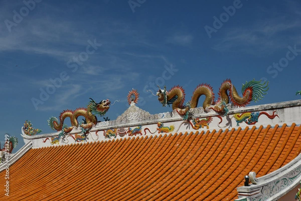 Fototapeta Beautiful Dragon Sculpture on The Roof in Wihan Thep Sathit Phra Kitthi Chalerm Shrine (Nacha Sa Thai Chue Shrine or Naja Shrine) Bang Sean, Chonburi, Thailand