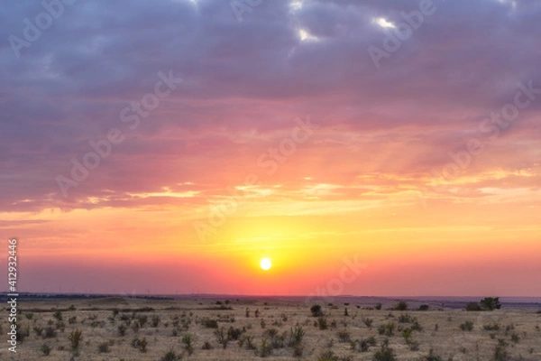 Fototapeta Beautiful sunset sky, plain, steppe, windmills in the distance