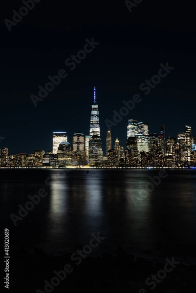 Fototapeta New York City Skyline at Night with reflection of the skyline in the Hudson river