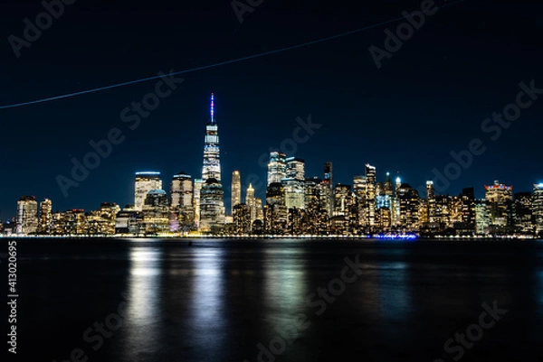 Fototapeta New York City Skyline at Night with reflection of the skyline in the Hudson river