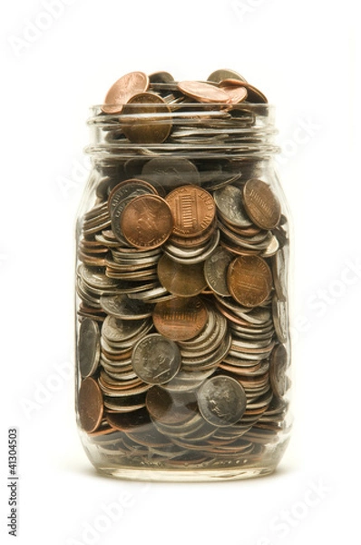 Fototapeta Glass jar overflowing with American coins
