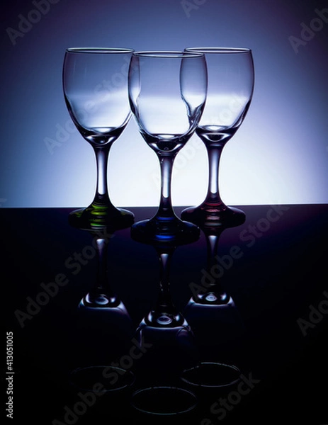 Obraz Empty wine glasses with colored stems
