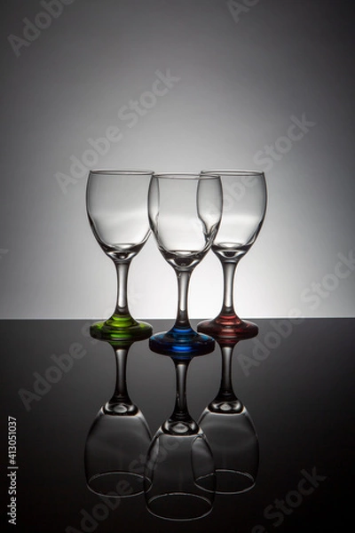 Obraz Empty wine glasses with colorful stems
