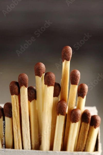 Fototapeta Matches stick out from an open matchbox.