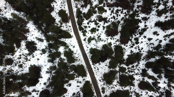 Obraz road through snowy mountains