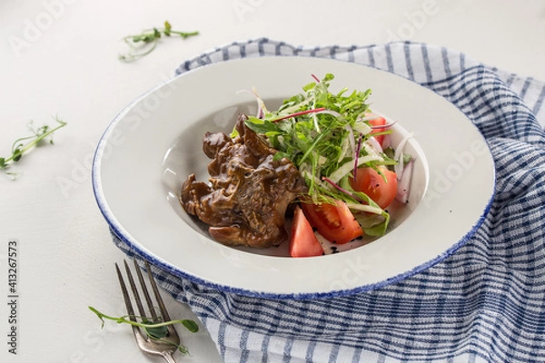 Obraz Balsamic Braised Beef slow cooked beef roast with fresh tomatoes on the table