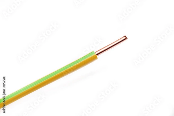 Fototapeta Copper wire with yellow and green markings on a white background