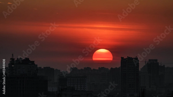 Obraz Sunset over a large city.