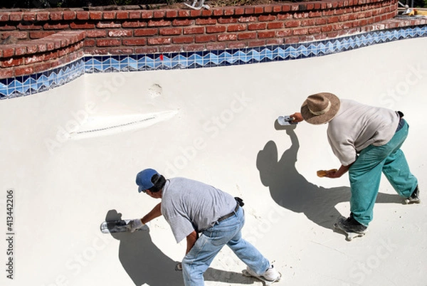 Obraz Masons smoothing swimming pool plaster