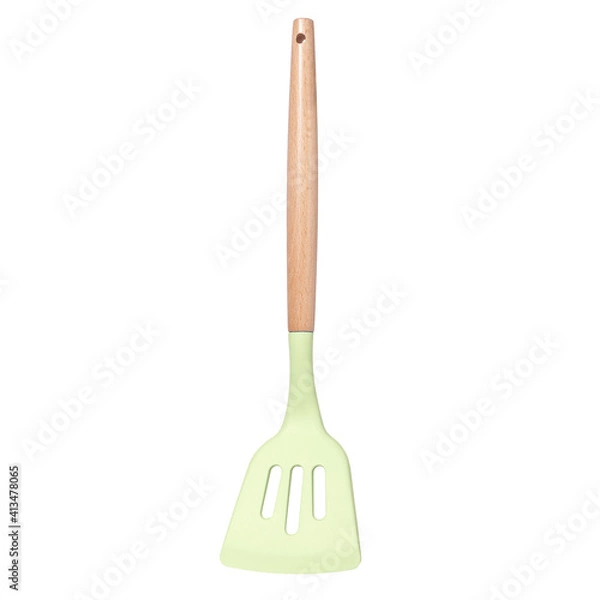 Fototapeta Green silicone kitchen spatula with slots with wooden handle isolated on white background
