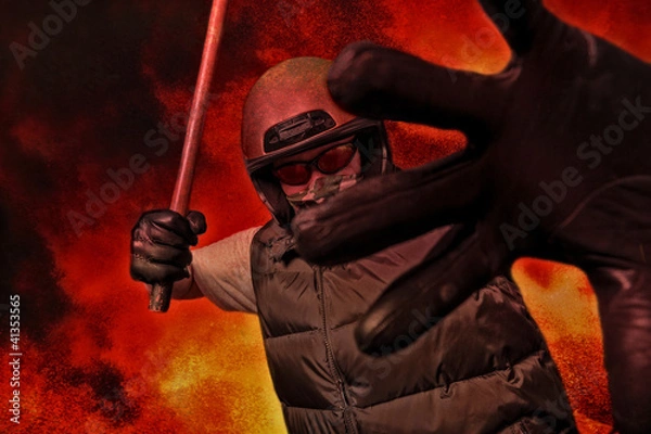 Obraz protester with stick during riot