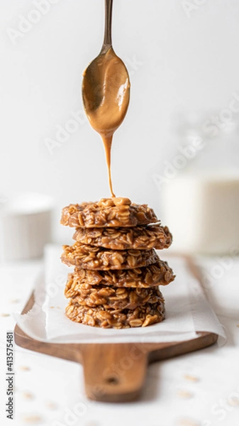 Obraz Morning Breakfast Energy Biscuit Cookies With Oats and Peanut Butter, Served with Dairy Milk