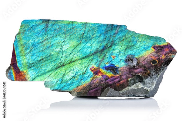 Fototapeta Sample of Amazing rare colorful iridescence Blue Labradorite/Spectrolite gemstone rough or geode. Aurora Borealis mineral stone closeup on white background. Beautiful piece of expensive Crystal