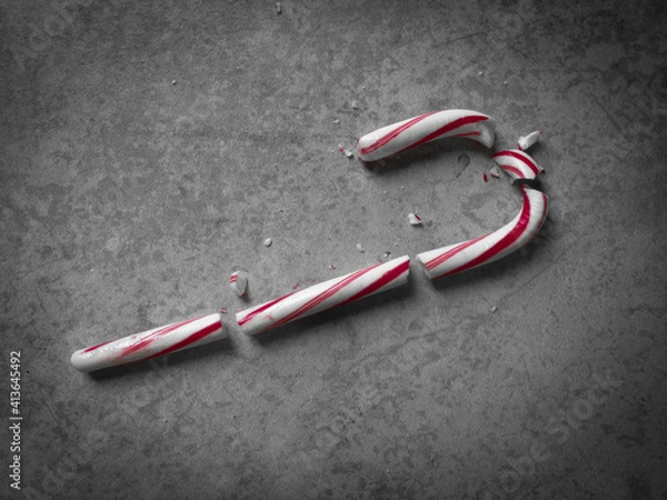 Fototapeta Moody Top-Down Shot of a Red and White Candy Cane that has Been Shattered into Multiple Pieces