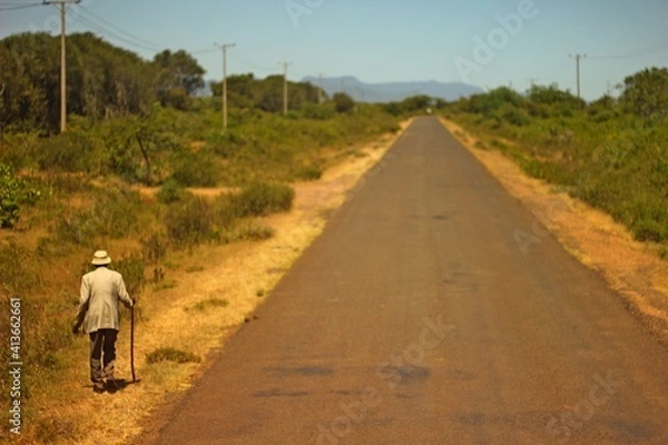 Fototapeta Old African man, on an endless road