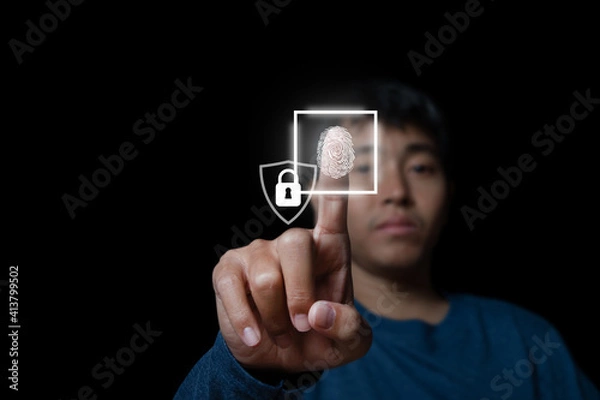 Obraz Businessman with technology fingerprint scan provides security.