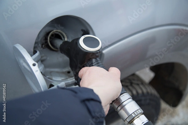 Fototapeta Gun for refueling. Gas station.Refueling the car.