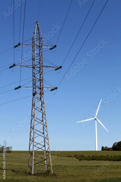 Obraz High voltage power line against the background of a wind turbine