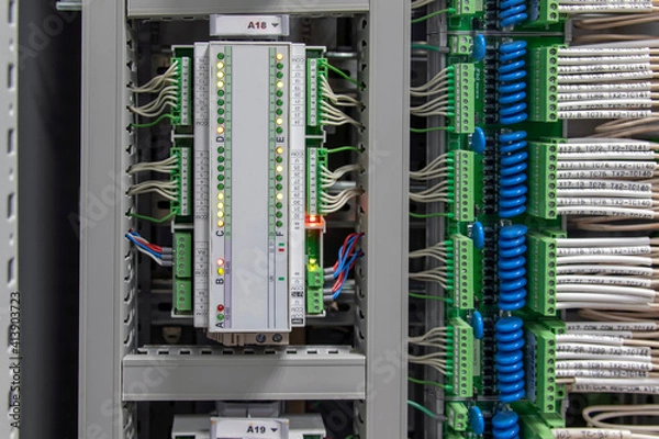 Fototapeta Automatic control systems close-up. Components and Controls for Process Control and Industrial Automation Solutions Fiber Optic Networking Equipment.