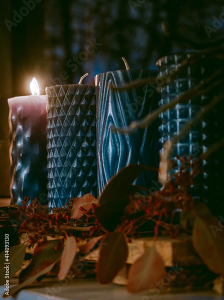 Fototapeta Modern Advent wreath or crown on a wooden plank with dried plants and four blue candles