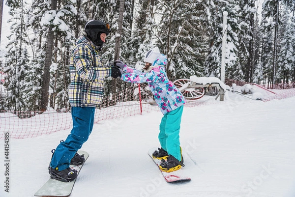 Fototapeta Learning to snowboard