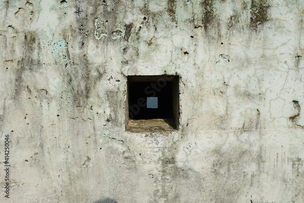 Fototapeta Photo of an old rustic wall with window inside a window.