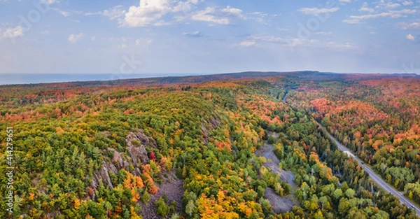 Fototapeta Autumn aerial views on the drive through the tunnel of Trees in Michigan Upper Peninsula UP - Highway 41  M26 Aerial view