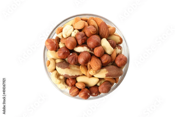 Fototapeta Bowl with different nuts isolated on white background