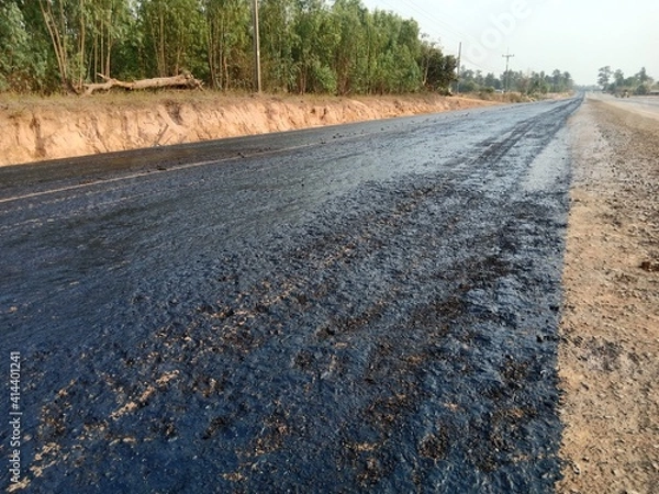 Obraz Tire spraying for road construction