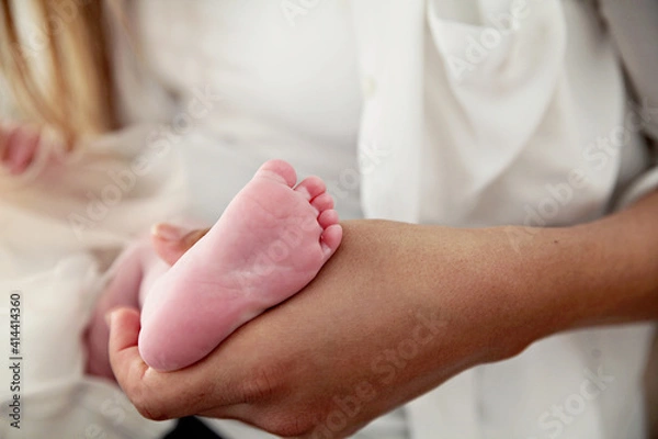 Fototapeta Feet of a newborn baby