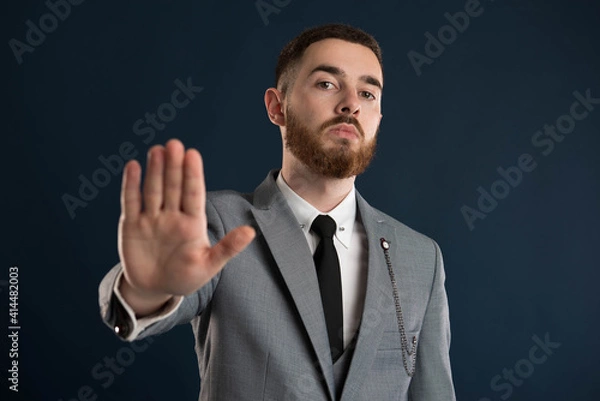 Obraz Upset young businessman saying stop