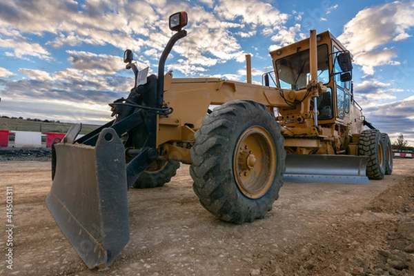 Fototapeta Grader working on gravel leveling