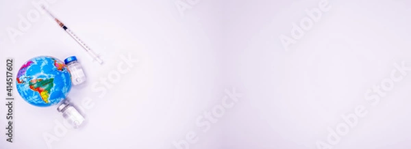 Obraz Pandemic concept, close up of scientist injecitng vaccine into the earth Copy Space