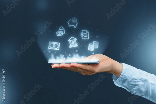Fototapeta Person holds a smartphone with mobile banking icons projection.
