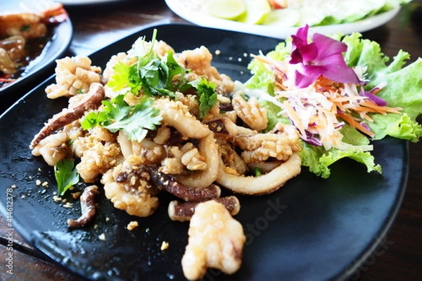 Fototapeta Fried squid with garlic is a great menu that children are very popular to order.