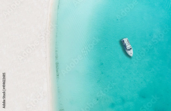Obraz Drone photo of beach in Sapodilla Bay, Providenciales, Turks and caicos, boat by itself