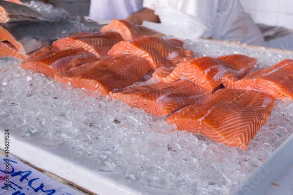 Obraz Fresh salmon fillet preserved on ice.