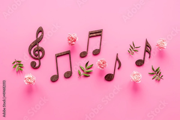 Fototapeta Flat lay of musical notes with flowers. Love songs concept