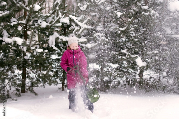 Fototapeta happy young girl playing with snow outdoor, winter background