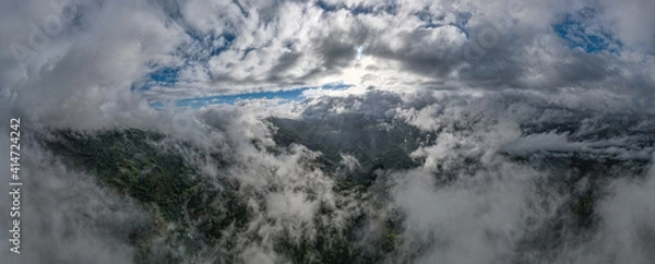 Fototapeta sunrise with clouds above the mountains 