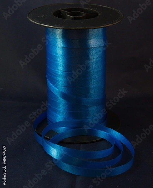 Obraz Gift strings on plastic reels.