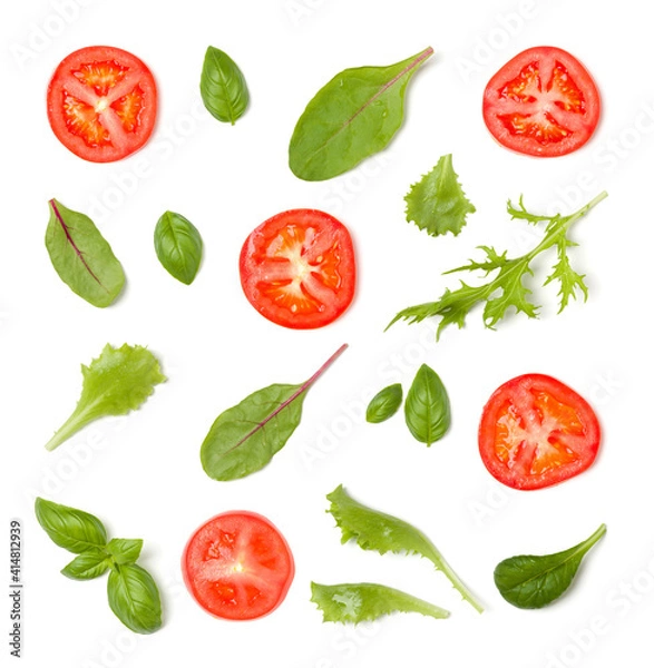 Fototapeta Creative layout made of tomato slices and lettuce salad leaves. Flat lay, top view. Food concept. Vegetables isolated on white background. Food ingredients pattern.