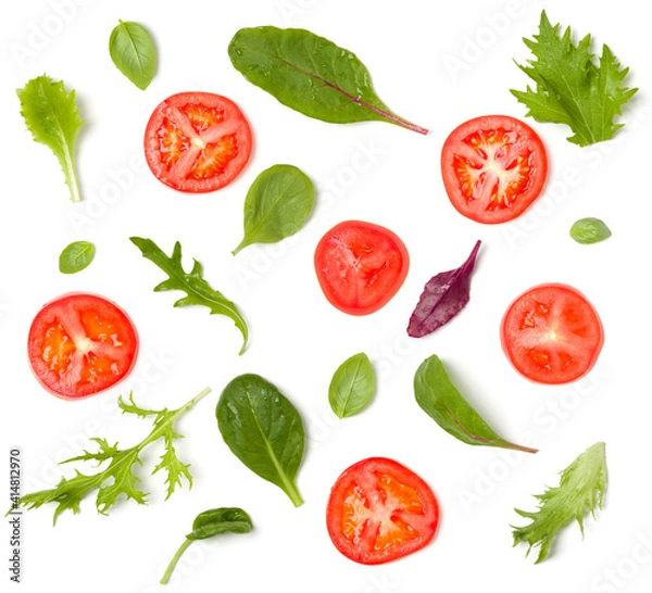 Fototapeta Creative layout made of tomato slices and lettuce salad leaves. Flat lay, top view. Food concept. Vegetables isolated on white background. Food ingredients pattern.