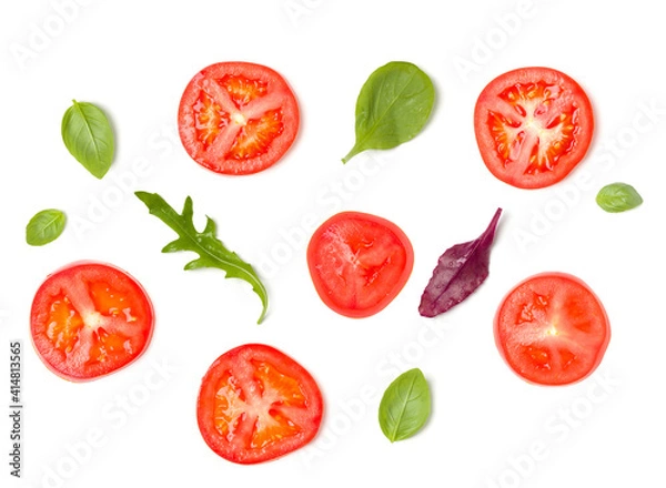 Fototapeta Creative layout made of tomato slices and lettuce salad leaves. Flat lay, top view. Food concept. Vegetables isolated on white background. Food ingredients pattern.