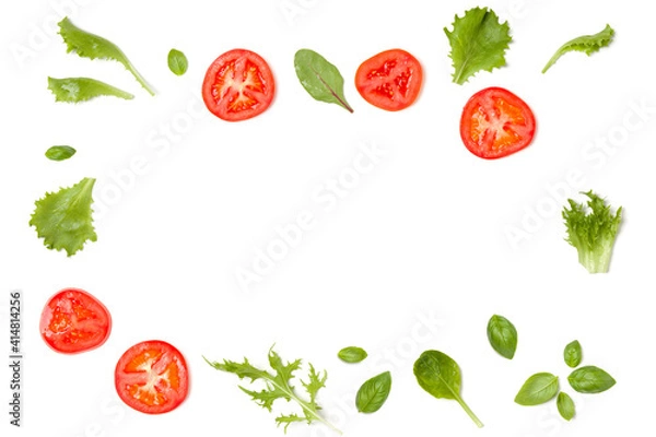 Fototapeta Creative layout made of tomato slices and lettuce salad leaves. Flat lay, top view. Food concept. Vegetables isolated on white background. Food ingredients pattern with copy space.