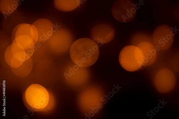 Fototapeta Abstract dark orange dots black background for texture	