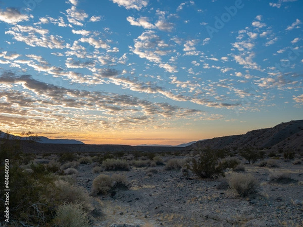 Obraz Desert sunrise with scattered fluffy clouds, Mesquite Springs, Death Valley.