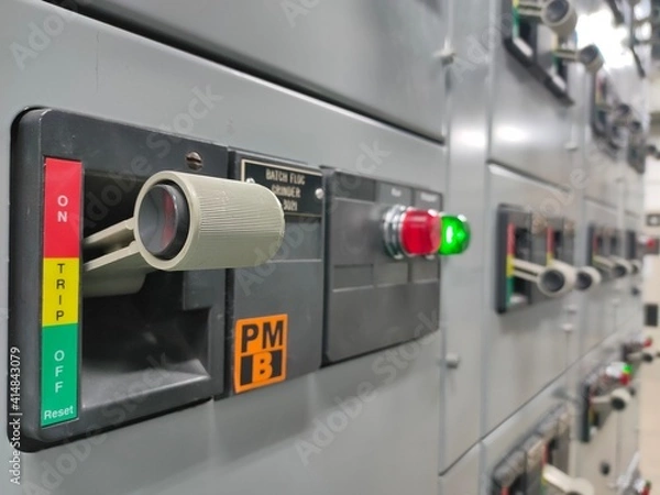 Obraz Select focus circuit breaker in Electric room on industrial,   	Rocker switch for start or stop motor.